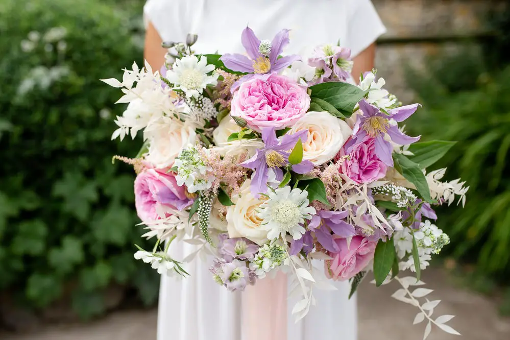 How far in advance do I need to plan wedding flowers?